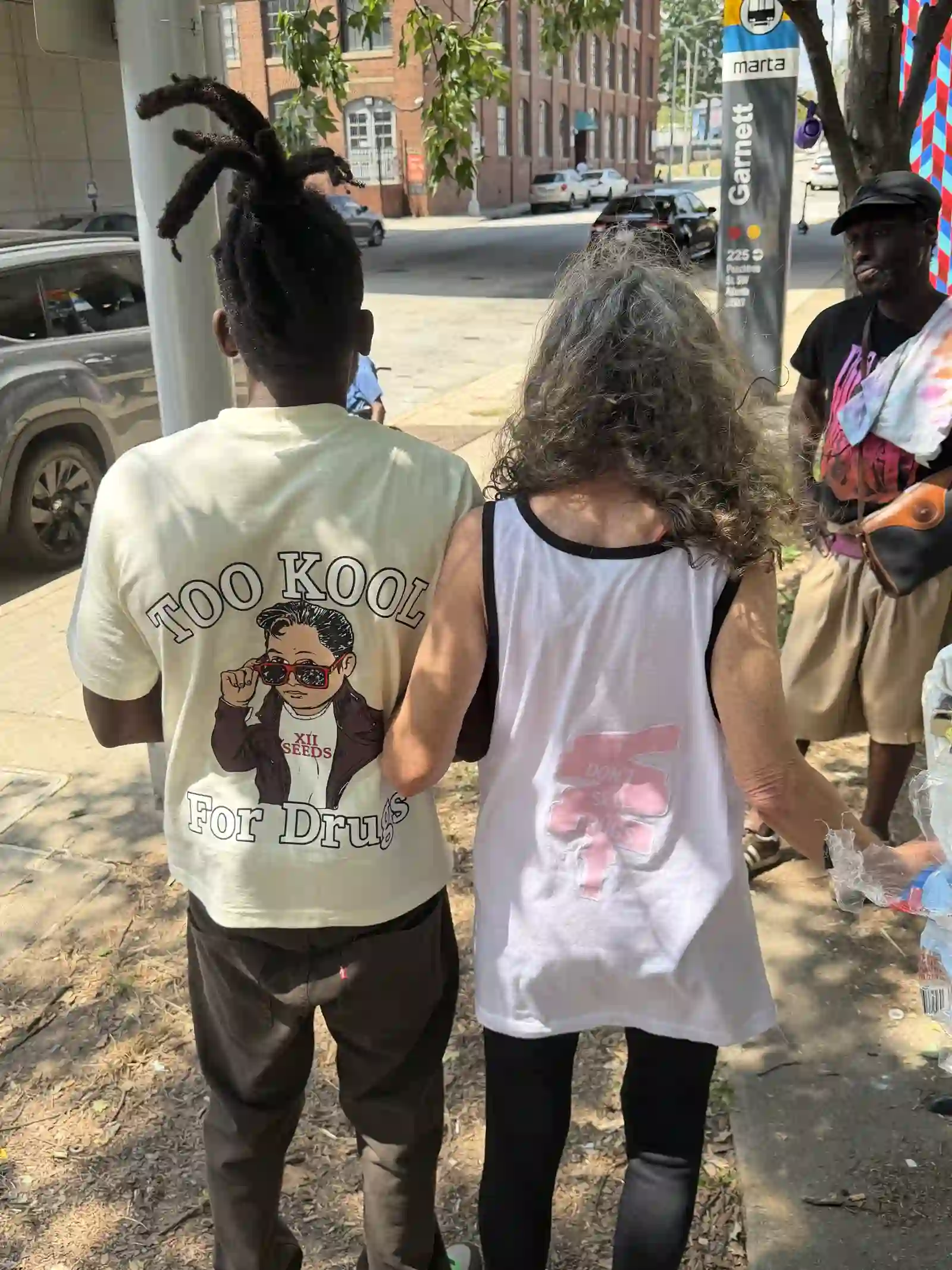 Man and woman walking arm in arm after an outreach event
