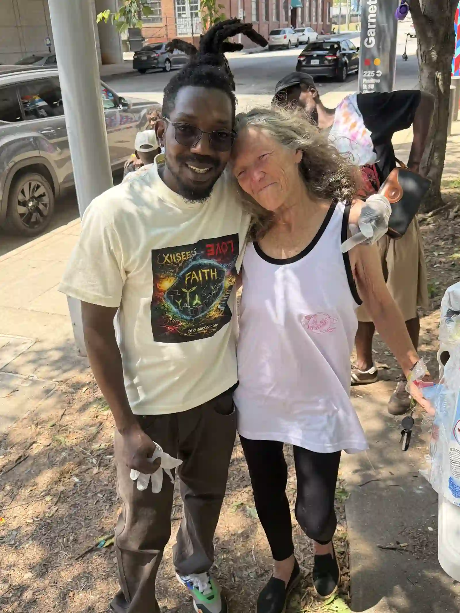 Man and woman embracing and smiling at the camera
