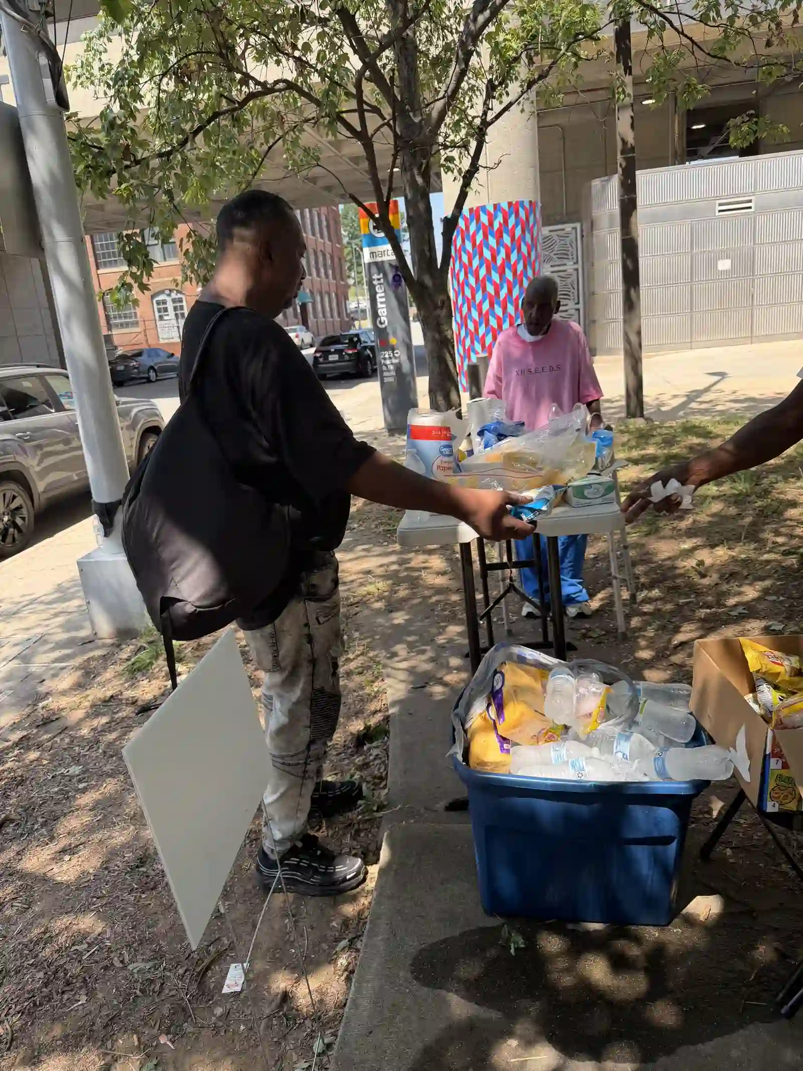 Community members gathered at the outreach supply table