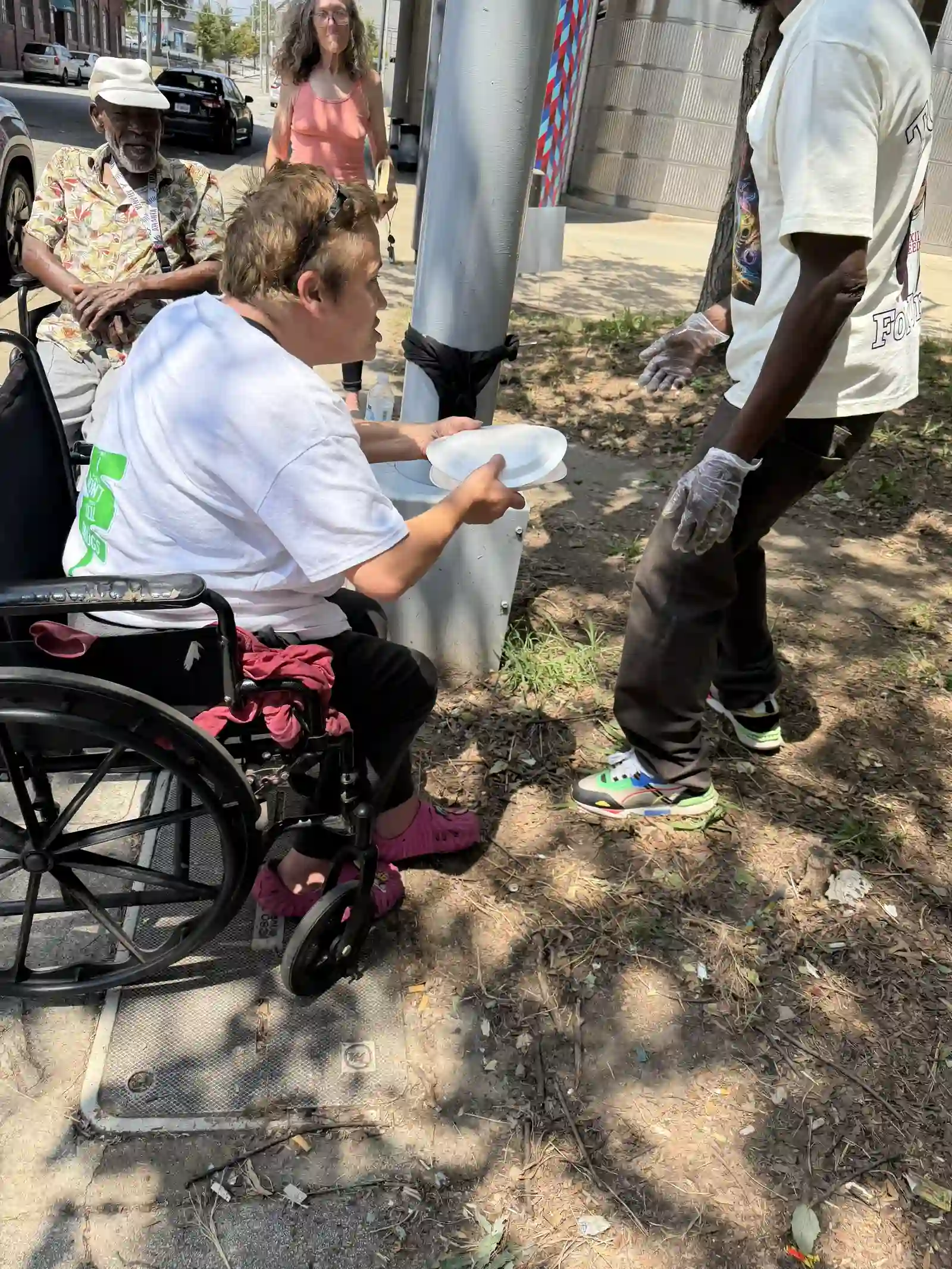 Volunteer helping a woman in a wheelchair