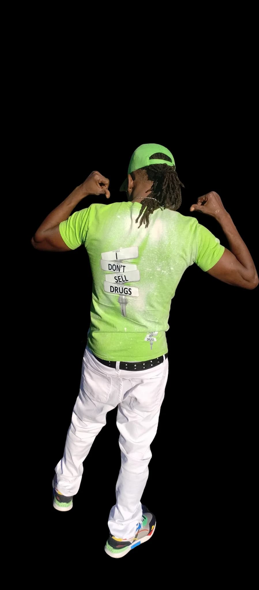 Man in a neon green tee showing the 'I Don't Sell Drugs' back graphic