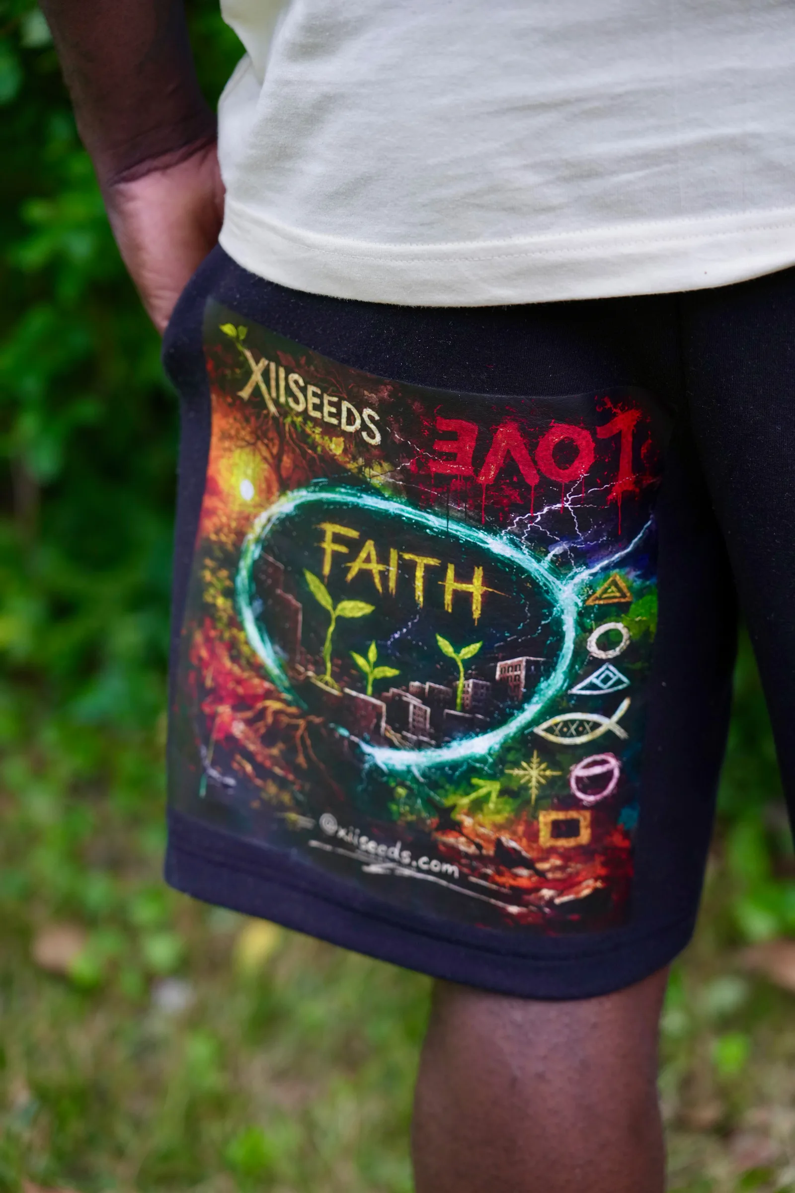 XII SEEDS FAITH graphic on navy shorts, outdoor lifestyle shot